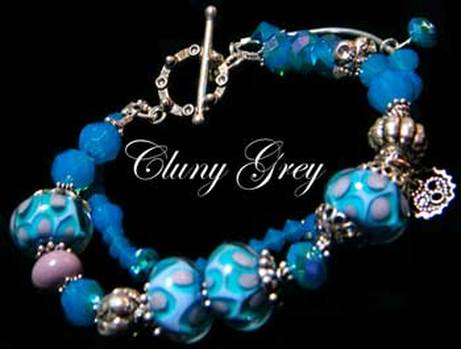 handmade Swarovski crystal bracelet with lampwork beads, blue opals and charms