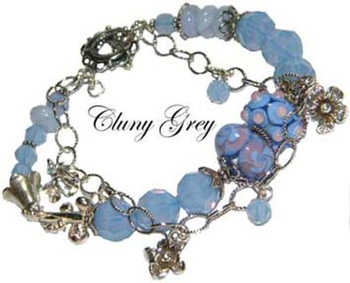 Swarovski crystals bracelet with air blue opal and sterling silver flower charms.